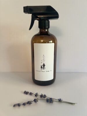 Amber glass with pump: Amber glass bottle with black push-down pump dispenser on a white background